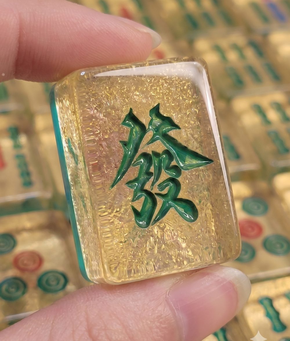 A Green Dragon tile held up to the camera
